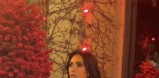 Kim Kardashian stuns in silver sequin dress as she joins family on Christmas Eve