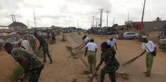 Soldiers Swap Guns For Brooms In Community Clean-Up In Ogun