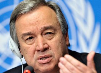 UN raises alarm over xenophobic violence in South Africa Diplomat wearing a headset speaks into a microphone, gesturing with his hand against a UN backdrop.