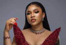 Guys are scared of successful women – Diiadem claims Glamorous woman in a red sequined gown with matching jewelry and bold makeup, looking at the camera.
