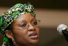 2027: ‘It will be too late for Obi to return to Labour Party’ – Usman Woman with a vibrant green patterned headwrap and glasses speaking into a microphone at a podium.