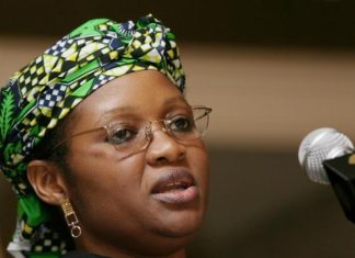 2027: ‘It will be too late for Obi to return to Labour Party’ – Usman Woman with a vibrant green patterned headwrap and glasses speaking into a microphone at a podium.