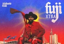 Adekunle Gold releases deluxe album ‘Fuji Xtra’, features Olamide Album cover for Adekunle Gold's Fuji Xtra: man in a red suit and black hat sits atop a stylized cityscape against a purple-blue sunset, with 'Fuji Xtra' text and Adekunle Gold logo.