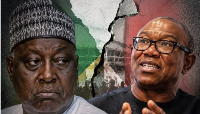 Two men stand on opposite sides of a cracked wall with Nigerian flag colors behind them; the left man looks serious while the right man speaks.
