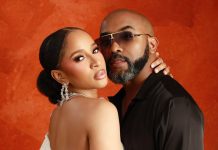 Adesua Etomi-Wellington reflects on marriage to Banky W Couple posing closely against an orange textured backdrop; woman wears a white strapless dress and crystal chandelier earrings, man wears sunglasses and a black shirt.
