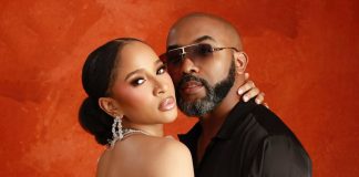 Adesua Etomi-Wellington reflects on marriage to Banky W Couple posing closely against an orange textured backdrop; woman wears a white strapless dress and crystal chandelier earrings, man wears sunglasses and a black shirt.