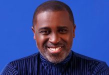 Frank Edoho confirms relationship status, makes shocking vows Head-and-shoulders portrait of a smiling Black man in a dark striped shirt against a blue backdrop.