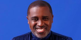 Frank Edoho confirms relationship status, makes shocking vows Head-and-shoulders portrait of a smiling Black man in a dark striped shirt against a blue backdrop.