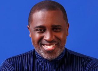 Frank Edoho confirms relationship status, makes shocking vows Head-and-shoulders portrait of a smiling Black man in a dark striped shirt against a blue backdrop.