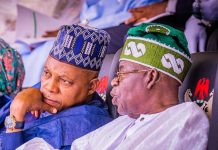 ‘They said I wanted to kill President Tinubu’ – VP Shettima Two men wearing traditional caps sit closely, one resting his chin on his hand in thoughtful conversation beside a white-clad elder in a green-patterned hat.