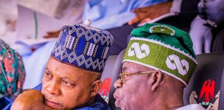 ‘They said I wanted to kill President Tinubu’ – VP Shettima Two men wearing traditional caps sit closely, one resting his chin on his hand in thoughtful conversation beside a white-clad elder in a green-patterned hat.