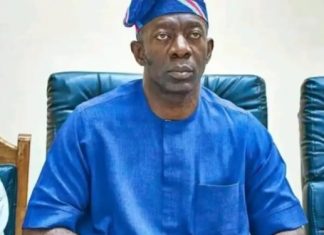 2027: Makinde backs Adekambi as preferred successor Man in a blue traditional outfit and headwrap seated in a conference room, facing the camera.