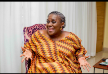 “I was shocked some films got no nominations” – Joke Silva opens up on AMVCA selection process A smiling woman in a colorful zigzag dress sits on a patterned chair, gesturing with open hands as she speaks.