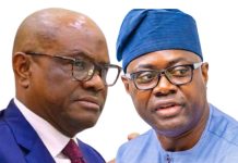 Wike dismisses PDP-APM alliance, says Makinde’s presidential ambition ‘dead on arrival’ Two men in conversation, one in a blue suit and red tie, the other in a blue traditional cap and attire, against a white background.