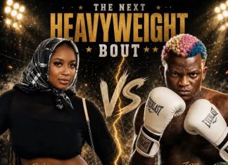 Man vs Woman: Portable challenges female DJ to Celebrity Boxing fight Promotional poster for 'The Next Heavyweight Bout' showing a female fighter in a black outfit and hijab left, and a male boxer with colorful hair right, facing off with a glowing 'VS' between them. The title and lights suggest a high-stakes match.