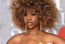 Marriage was designed to benefit men — Chidera Eggerue argues Portrait of a woman with a voluminous curly afro, wearing a gold spaghetti-strap dress and dangling earrings at a red carpet event.
