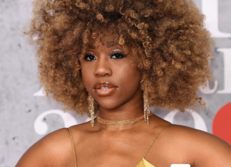 Marriage was designed to benefit men — Chidera Eggerue argues Portrait of a woman with a voluminous curly afro, wearing a gold spaghetti-strap dress and dangling earrings at a red carpet event.