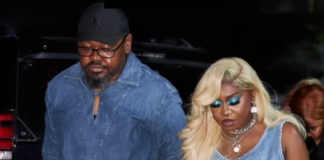BREAKING: Singer Niniola loses husband Man and woman walking hand in hand at night; man in denim shirt and cap, woman in sleeveless denim top with long blonde hair and jewelry.