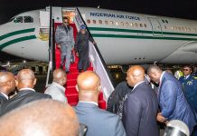 President Tinubu arrives Nairobi for Africa Forward Summit Dignitaries step down from a Nigerian Air Force jet onto a red-carpeted stairs at night, surrounded by officials on tarmac.