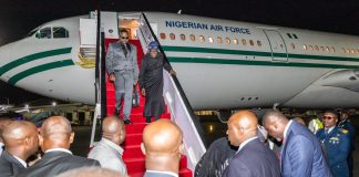 President Tinubu arrives Nairobi for Africa Forward Summit Dignitaries step down from a Nigerian Air Force jet onto a red-carpeted stairs at night, surrounded by officials on tarmac.