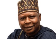 BREAKING: Makinde-led PDP appoints Turaki as interim national chairman Smiling man in a patterned cap and dark traditional attire against a white background, portrait.