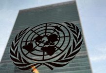 We’re very concerned – UN reacts to terrorists’ attacks on schools in Nigeria United Nations emblem on a reflective glass surface with a blurred building in the background.