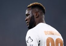 Boniface Reveals Why He Wears No. 22 Footballer in a white jersey, back visible with number 22 and name BONIFACE, facing left on the field.